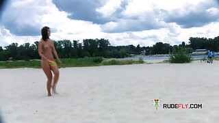 Two young nudist friends love going to the beach together